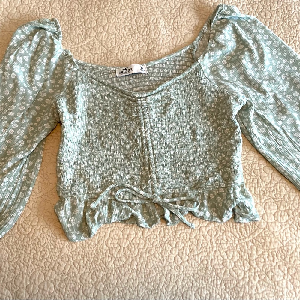 Holliston, size medium, cropped Sage green and white floral pattern.